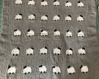 Contare il modello di lavorazione a maglia della coperta per bambini delle pecore