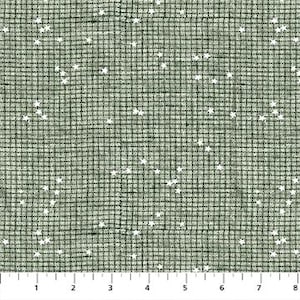 May include: A fabric with a grid pattern in shades of green and gray, speckled with small white star shapes. The fabric is measured with a ruler in inches, showing a scale from 1 to 8 inches.