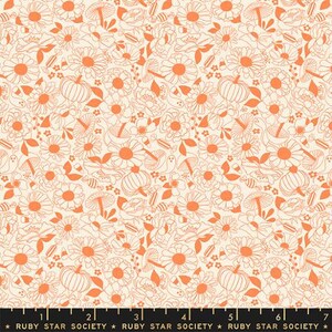 May include: A white fabric with a repeating pattern of orange line drawings of flowers, pumpkins, and ghosts. The pattern is a vintage style.