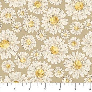 May include: A fabric with a repeating pattern of white daisies with gold centers on a tan background. The daisies vary in size and are evenly spaced across the fabric. A ruler is at the bottom of the image.