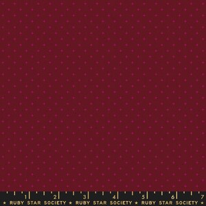 May include: Burgundy fabric with a repeating pattern of small, bright pink plus signs. The fabric has a subtle texture and a dark, rich color. The bottom of the image has the text "RUBY STAR SOCIETY".