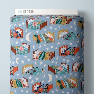 May include: A roll of fabric with a repeating pattern of mice sleeping in beds under a starry sky. The beds are various colors, and the bedding features floral and geometric designs. The fabric has the text "CLOUD9" on the top.