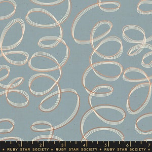 May include: A blue fabric with a white and copper colored abstract pattern of overlapping loops and swirls.