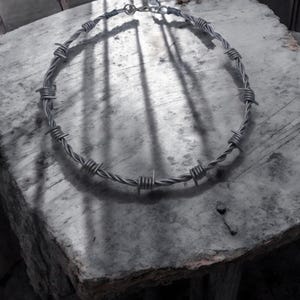 Handmade aluminium barb wire solid choker style necklace. Available in shiny, matte or dark matte grey or gold.