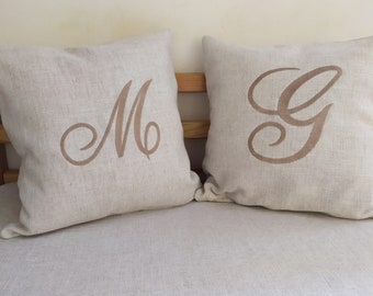 Decorative cushion with embroidered initial