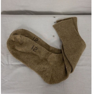 May include: A pair of brown wool socks with the size "12" printed on them.