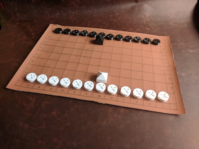 An ancient Roman Ludus Latrunculorum (also known as Latrunculi) board game set in starting array on a 12x8 board