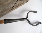 Rare twists fire poker oven fork. Iron with wooden handle.