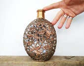 vintage Overall copper bottle with bird pattern. Antique mystical alcohol carafe