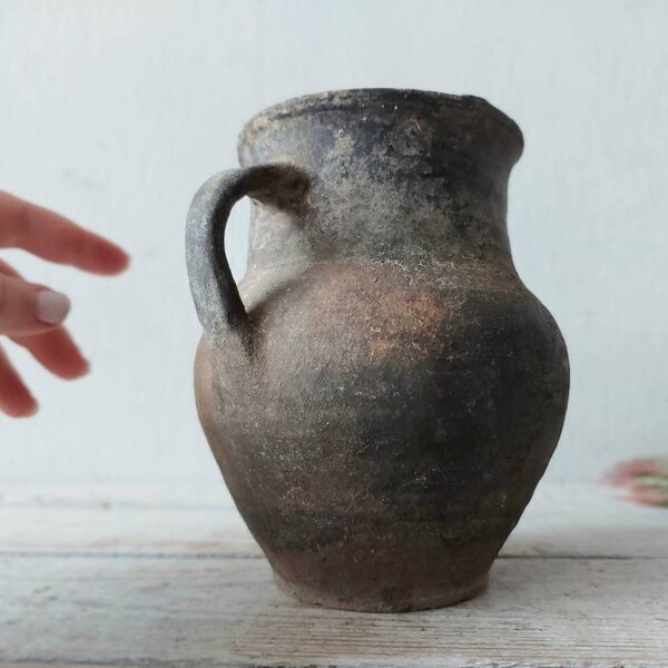 old clay jug. Wabi sabi gray pottery pot. Shabby chic Rustic Decor