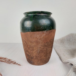 characteristic old clay vase. Wabi sabi vintage pottery flower jar. cozy cottage Rustic jug. antique farmhouse-style gift for kitchen