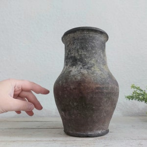 characteristic old clay vase. Wabi sabi vintage pottery flower jar. cozy cottage Rustic jug. antique farmhouse-style gift for kitchen