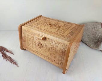 vintage carved wooden bread box. handmade lidded tabletop shelf for baked goods. rustic country kitchen organizer