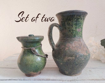 set of two green characteristic old clay vases. Wabisabi vintage pottery flower jar. cozy cottage Rustic jug. antique farmhouse-style