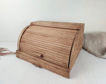 vintage carved wooden bread box. handmade lidded tabletop shelf for baked goods. rustic country kitchen organizer