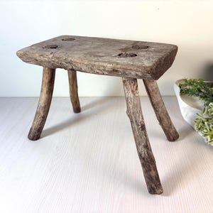 May include: A set of three ceramic mugs with a speckled, matte finish. The mugs are in shades of cream, light gray, and dark gray. Each mug has a simple, minimalist design, perfect for coffee or tea.