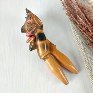 Hand-Carved Wooden Nutcracker with Intricate Detailing and Timeless Elegance