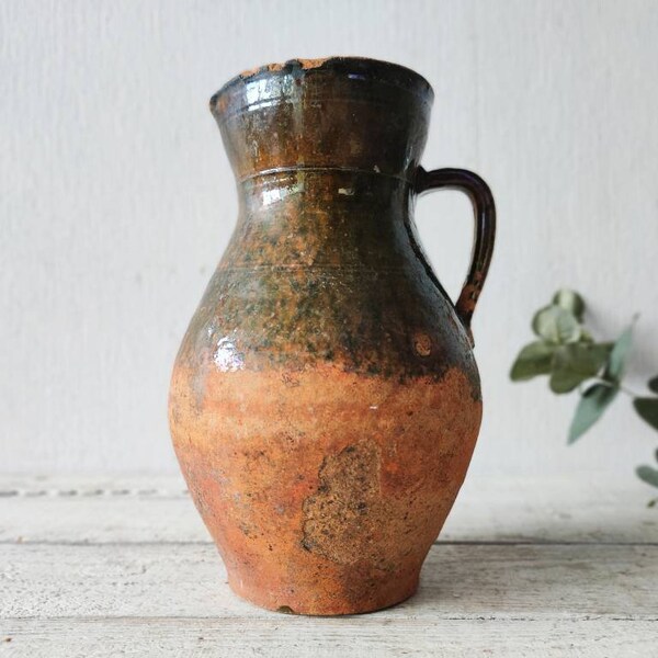 characteristic old clay vase. Wabi sabi vintage pottery flower jar. cozy cottage Rustic jug. antique farmhouse-style gift for kitchen