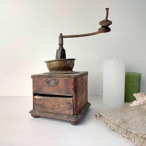 Vintage Wooden Coffee Grinder with Intricate Detailing and Rich Wood Finish Old-World Charm and Rustic Elegance