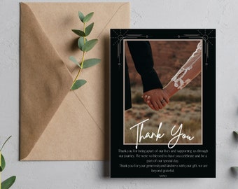 May include: A black and white thank you card with a photo of a couple holding hands. The card has a gold border and the text "Thank You" written in white cursive. The text reads: "Thank you for being apart of our lives and supporting us through our journey. We were so blessed to have you celebrate and be a part of our special day. Thank you for your generosity and kindness with your gift, we are beyond grateful. NONO."