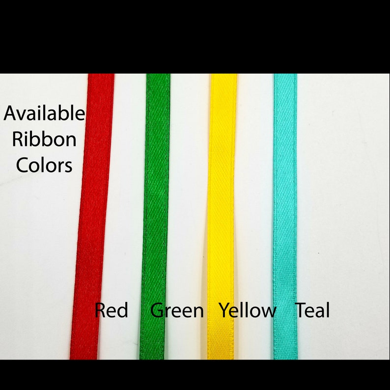 May include: Available ribbon colors: red, green, yellow, and teal. The ribbon is shown in four vertical strips.