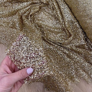Tessuto glitter oro Kleo Pizzo glitterato oro incollato Tessuto Shimmer Tessuto glitterato God Tessuto scintillante per matrimonio Tessuto glitter oro per matrimonio