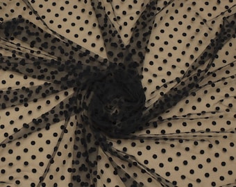 May include: Black sheer fabric with black polka dots. The dots are raised and have a velvety texture.
