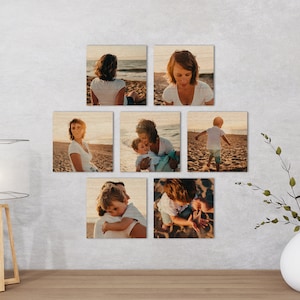 May include: A set of eight wood mounted photographs featuring a family on a beach. The photos show a woman and a child, a woman and a child, a woman, a woman, a child, a woman and a child, a woman and a child, and a woman and a child.
