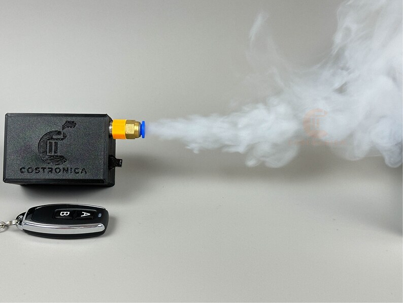 small 3dprinted plastic case that houses electronics to make a miniature sized smoke machine triggered via remote control.