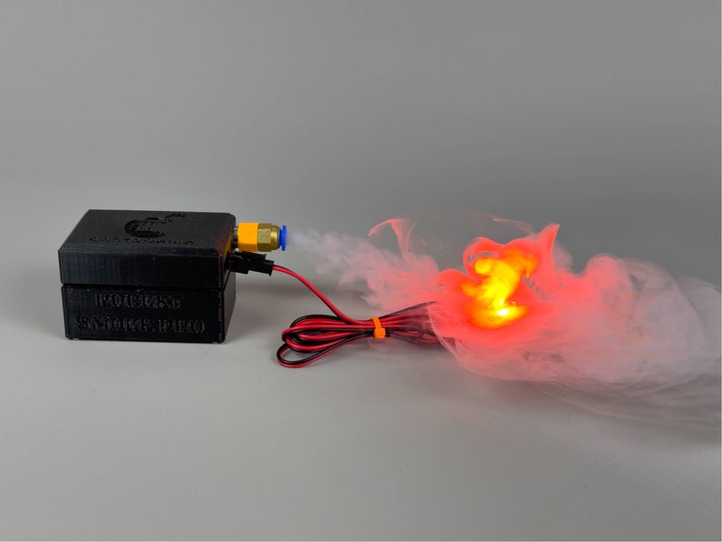 small 3dprinted plastic case that houses electronics to make a miniature sized smoke machine triggered via remote control.