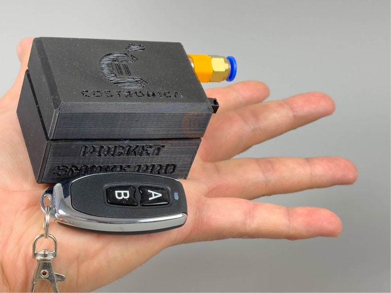 small 3dprinted plastic case that houses electronics to make a miniature sized smoke machine triggered via remote control.