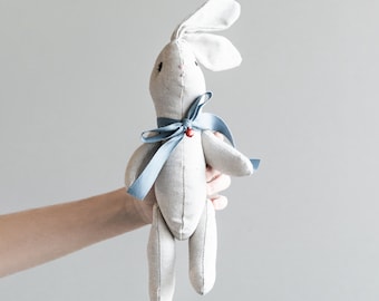 Bunny plush toy with blue bow and red bell. Made to order.