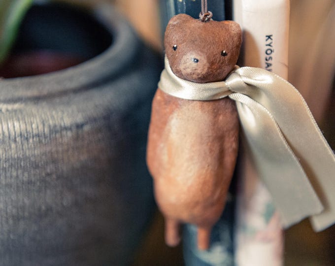 Featured listing image: Vintage inspired hanging decoration, spun cotton. Brown and gold antiqued bear with green collar.