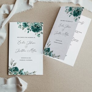 May include: Wedding program with a green floral design. The program includes the names Emilie Johnson and Jonathan Miller, the wedding date August 28, 2022, and the location Woodside, California.