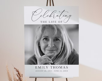 May include: A black and white photo of a woman with a gentle smile. The photo is on a white background with the text "Celebrating the life of Emily Thomas August 20, 1953 - June 23, 20XX".