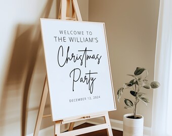 May include: White sign with black text on an easel. The sign says "Welcome to The William's Christmas Party December 12, 2024".