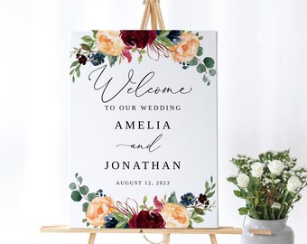 Könnte beinhalten: Willkommensschild für eine Hochzeit mit floralem Design in den Farben Burgunderrot, Pfirsich und Marineblau. Das Schild lautet "Willkommen zu unserer Hochzeit Amelia und Jonathan 12. August 2023".