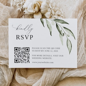 May include: A white card with a black and white QR code, green foliage, and the text "kindly RSVP" in black cursive. The text below the QR code reads "PLEASE SCAN THE QR CODE TO RSVP BY JUNE 12, 2026. FOR MORE DETAILS, VISIT OUR WEDDING WEBSITE: www.yourwebsite.com"