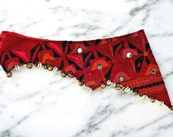 Hand embroidered belt.