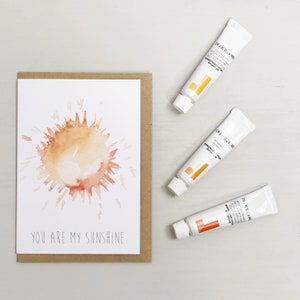 Carte de voeux d’aquarelle de soleil