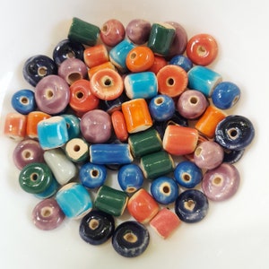 Set of beads weighing 100 grams. Multicolored beads of different shapes. The diameter of the hole is 2.5 mm.