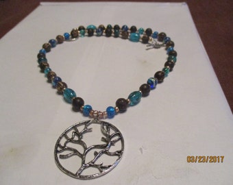 necklace,tree of life, coconut wood beads, blue glass beads,silver tone toggle clasp,"E" beads