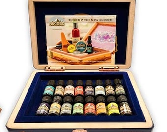 May include: Two wooden boxes with lids open, revealing a variety of small tins and bottles. The tins are filled with a colorful assortment of shoe polish. The bottles are filled with essential oils. The boxes are labeled "Rugged" and "Pledge".