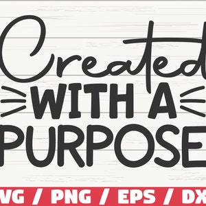 Puede incluir: Diseño gráfico de texto en blanco y negro con las palabras "Created with a Purpose" sobre un fondo de madera blanca.
