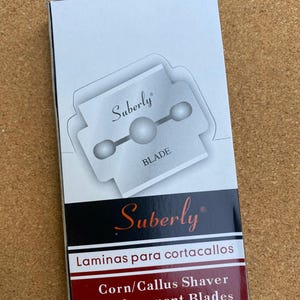 May include: A set of three ceramic mugs with a speckled, matte finish. The mugs are in shades of cream, light grey, and dark grey. Each mug has a simple, minimalist design, ideal for coffee or tea.