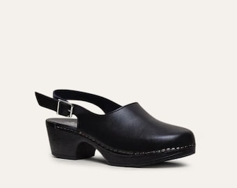 May include: Black leather clog with a slingback strap and a chunky heel.