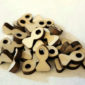May include: A pile of wooden beads in the shape of a stylized figure eight. The beads are light brown with dark brown edges.