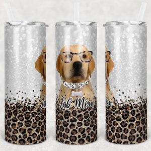May include: Three stainless steel tumblers with a glitter background and a leopard print design. The center tumbler features a cartoon Labrador Retriever wearing glasses and a bow tie with the text "Lab Mom" on the bottom.