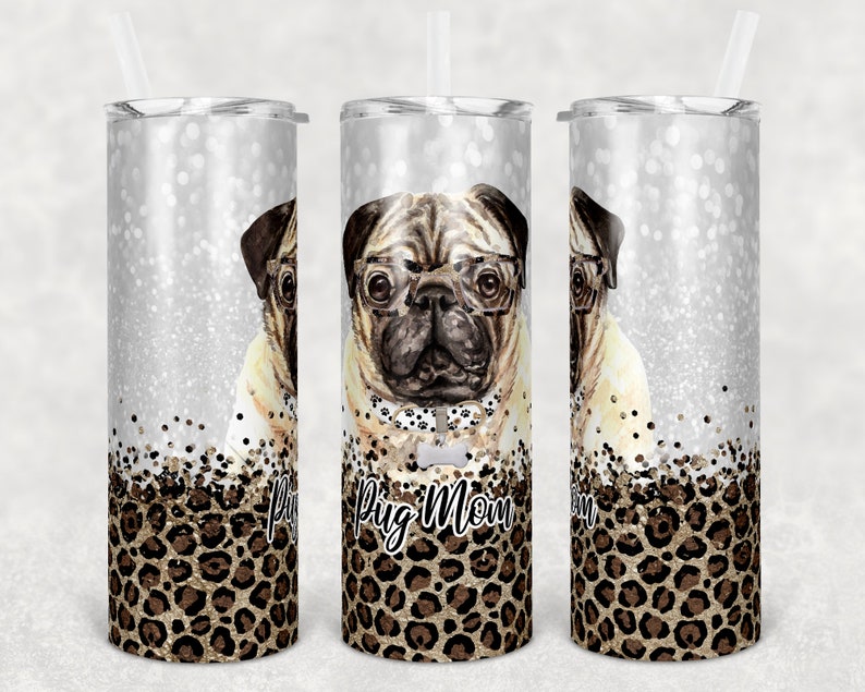 May include: A stainless steel tumbler with a silver glitter background and a leopard print design. The tumbler features a pug wearing glasses and a bow tie. The text "Pug Mom" is printed on the tumbler.