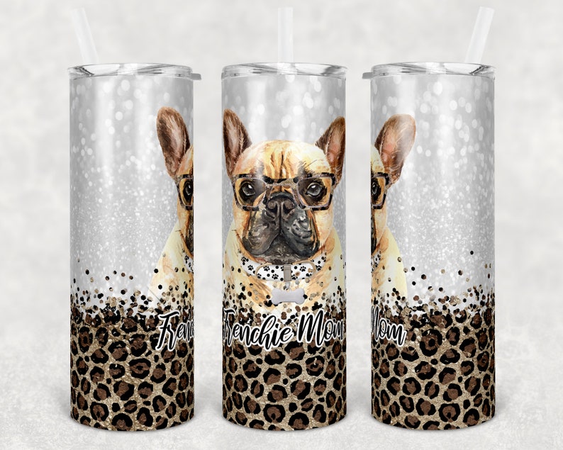 May include: Three stainless steel tumblers with a silver glitter background and a leopard print design. The center tumbler has the text "Frenchie Mom" in black lettering. Each tumbler features a cartoon image of a French bulldog wearing glasses.